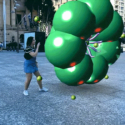 Person interacting with Artificial Ecology AR art outside