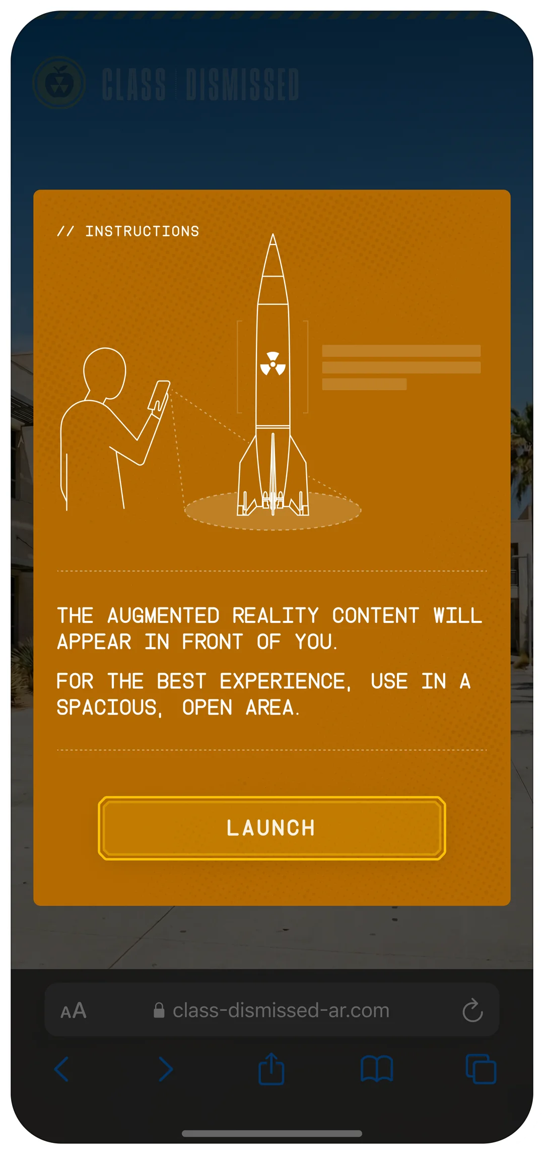 Class Dismissed - the instructions card, a line drawing of a person pointing a phone at a missile, asking for a spacious, open area