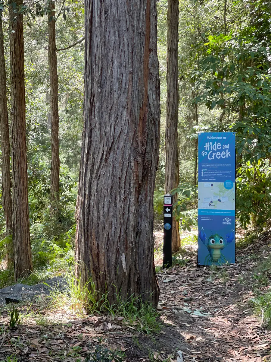 Hide and Go Creek - welcome sign at the trail head, showing the badge map of creek locations across Hornsby Shire and Craig the crayfish