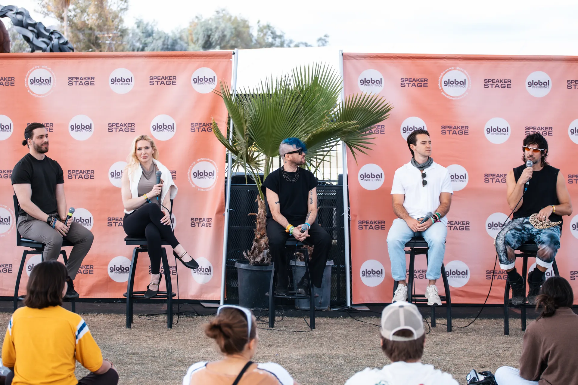 Sutu, Mo Ghoneim, Danny Klein and Ryan Cenicola seated on stage for the AI and Music panel at Coachella's Global Speaker Stage
